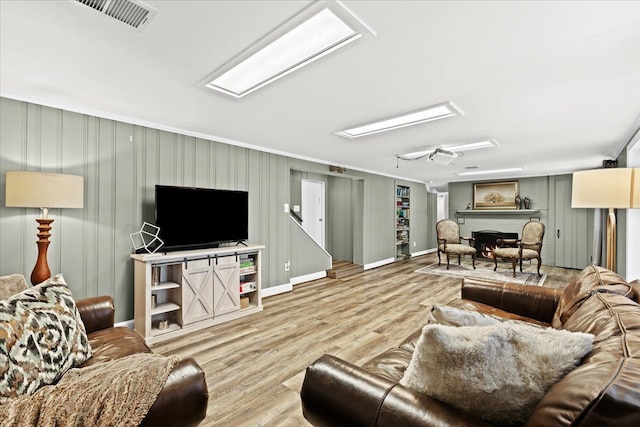 living room with light hardwood / wood-style floors