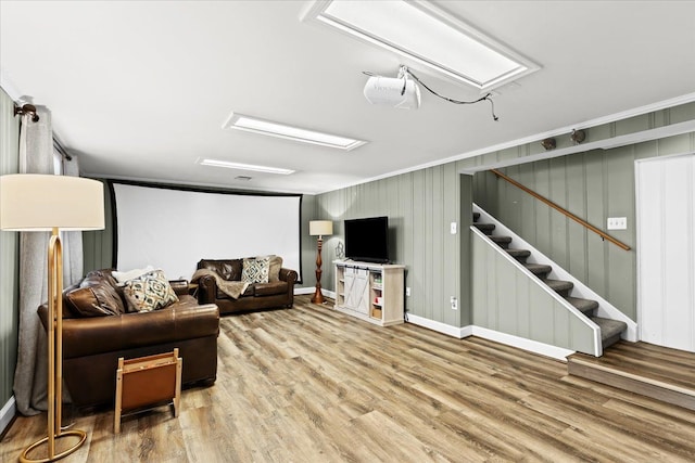 living room featuring wood-type flooring and ornamental molding