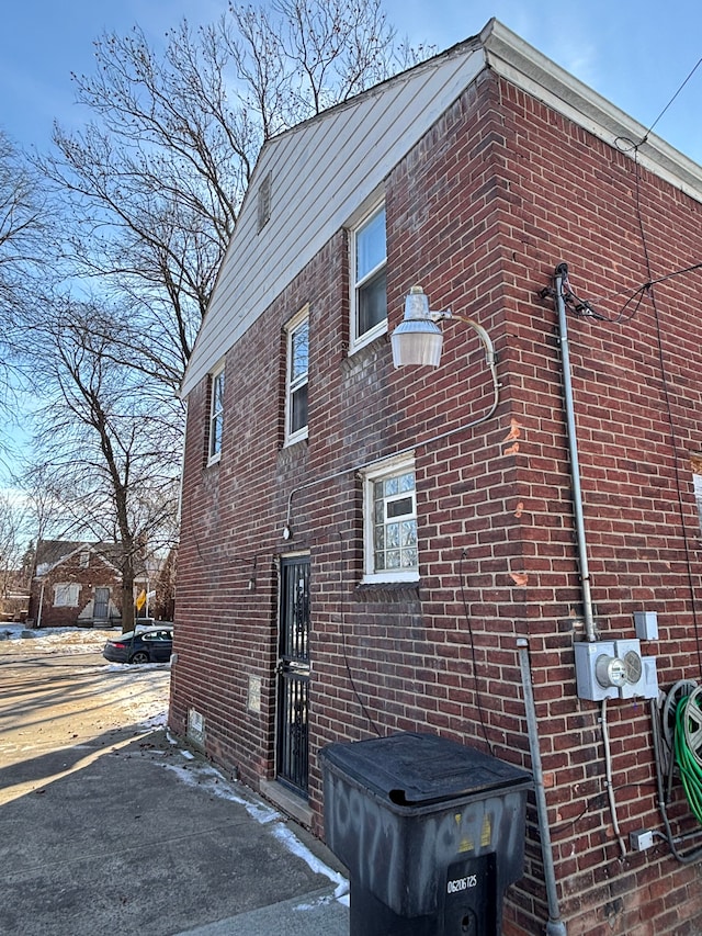 view of home's exterior featuring brick siding