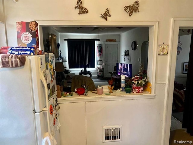 kitchen featuring white refrigerator