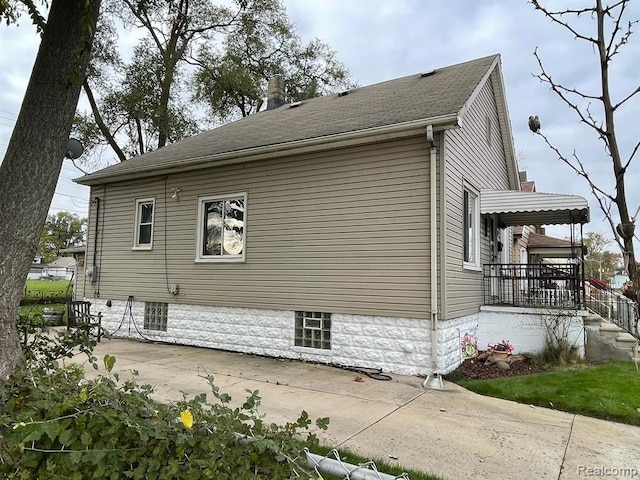 view of side of home featuring a patio