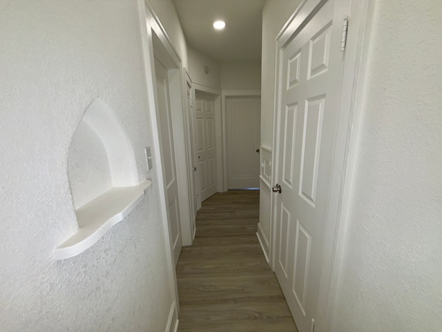 hallway featuring hardwood / wood-style flooring