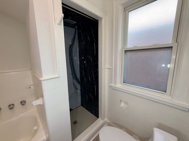 bathroom featuring plus walk in shower and toilet