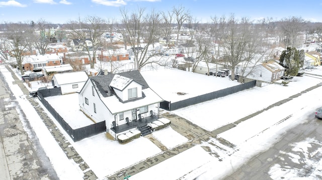 snowy aerial view with a residential view