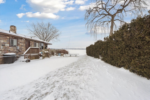 view of yard layered in snow