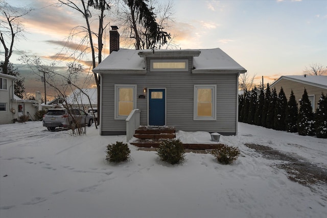 view of snow covered house