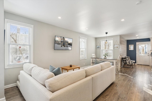 living room with dark hardwood / wood-style floors