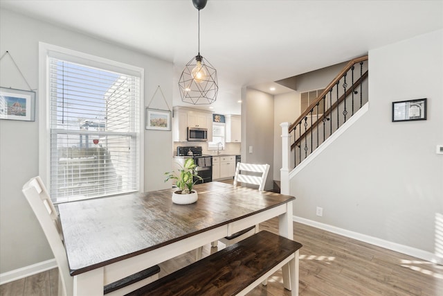 dining area with light hardwood / wood-style floors