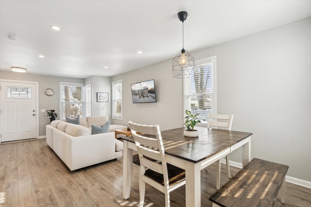 dining space with light wood-type flooring