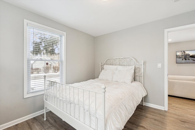 bedroom featuring wood-type flooring