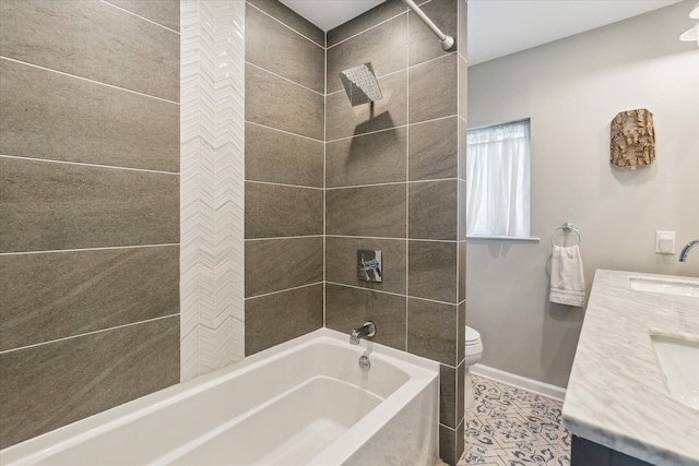 full bathroom with tiled shower / bath, vanity, toilet, and tile patterned flooring