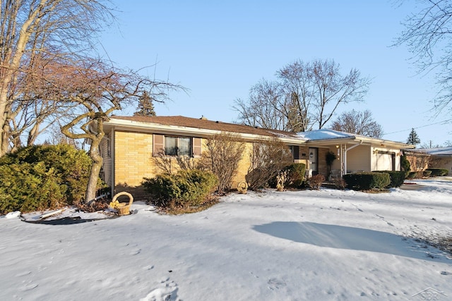 ranch-style house featuring a garage