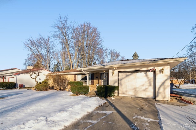 single story home featuring a garage