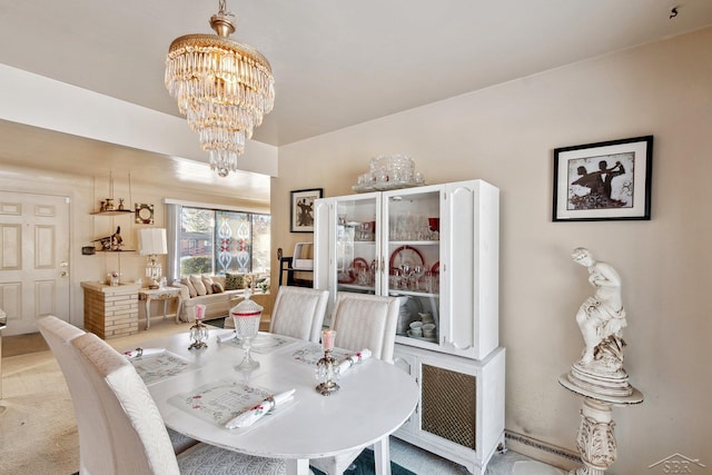 dining space with a chandelier