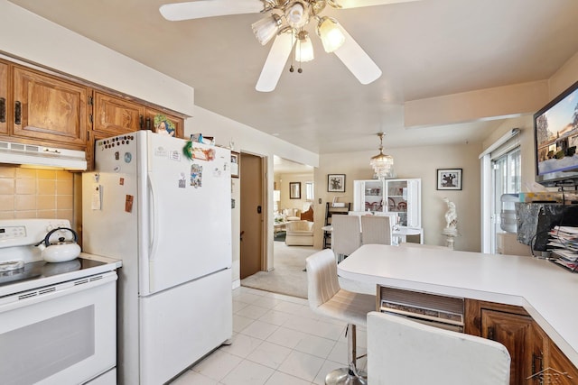 kitchen featuring decorative light fixtures, decorative backsplash, light tile patterned floors, ceiling fan, and white appliances