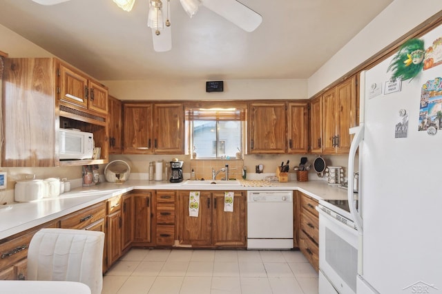 kitchen featuring sink, white appliances, and ceiling fan