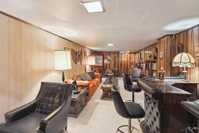 home office with wooden walls and ornamental molding