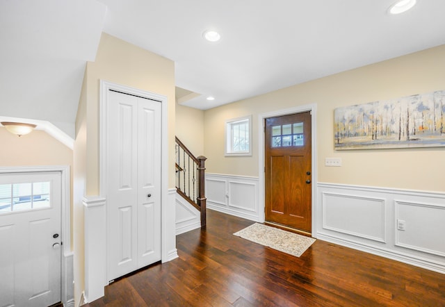 foyer entrance featuring wainscoting, stairway, recessed lighting, and wood-type flooring