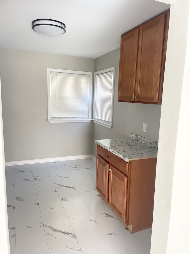 kitchen with light stone countertops