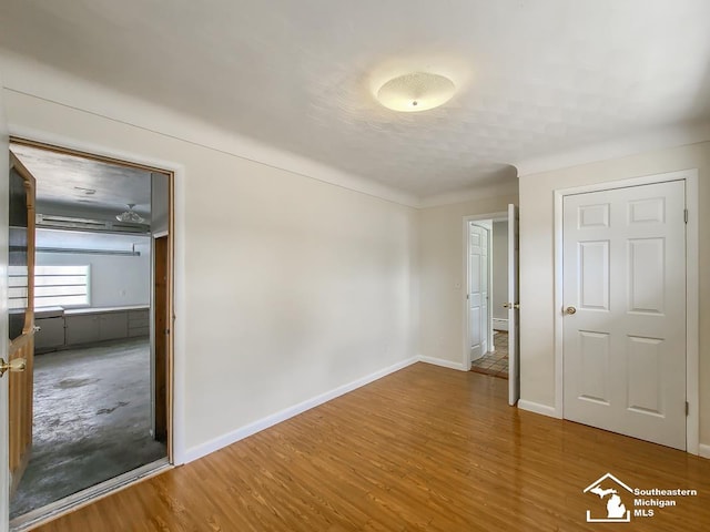 spare room with hardwood / wood-style flooring