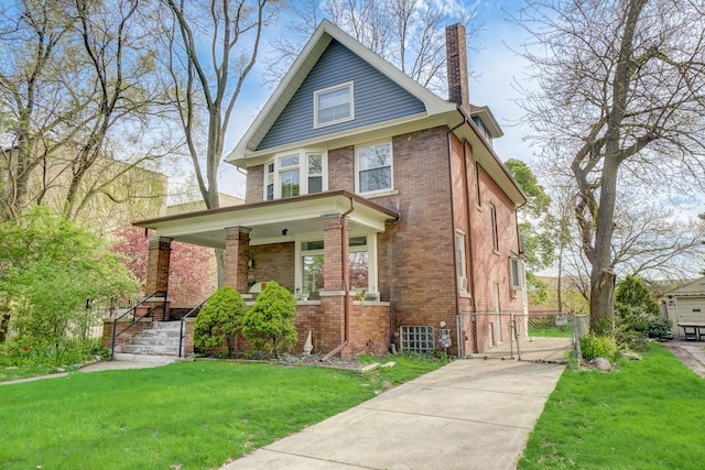 view of front of house with covered porch and a front yard