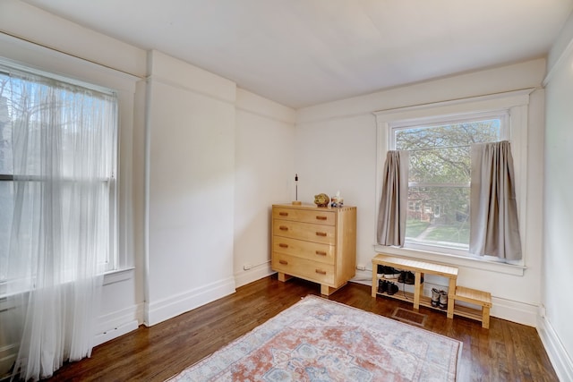 miscellaneous room with dark hardwood / wood-style flooring