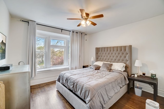 bedroom featuring dark hardwood / wood-style flooring and ceiling fan