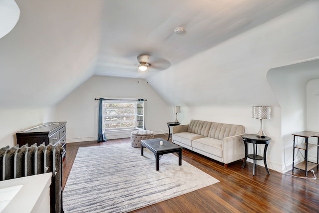 living room with lofted ceiling, radiator, dark wood-type flooring, and ceiling fan