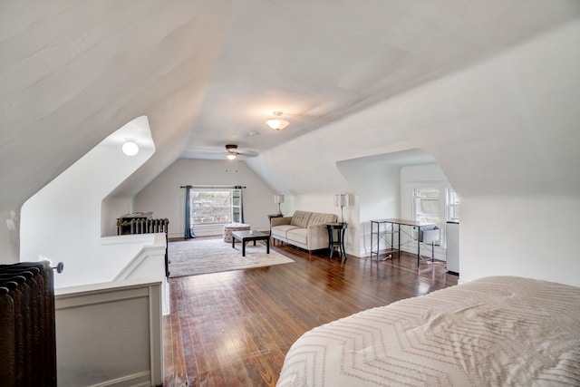 bedroom featuring lofted ceiling and dark wood-type flooring