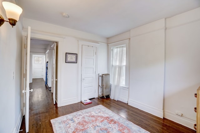 bedroom featuring dark hardwood / wood-style flooring