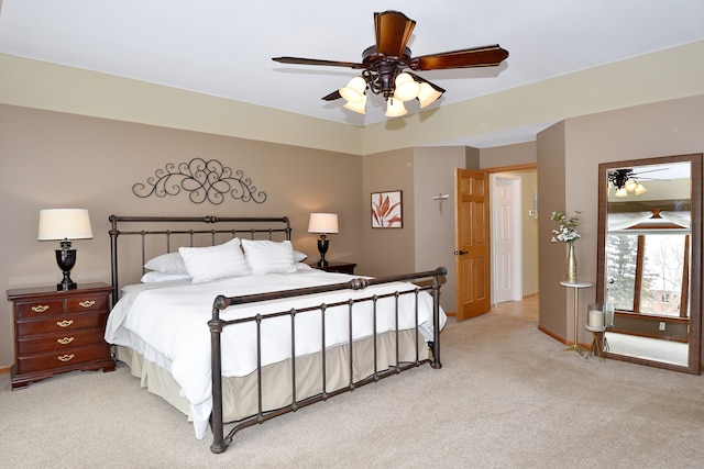 bedroom featuring baseboards, a ceiling fan, and light colored carpet