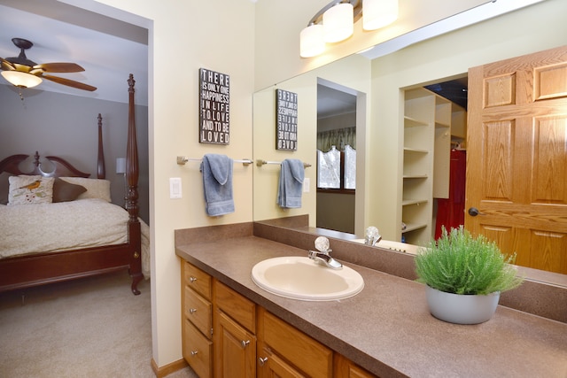 ensuite bathroom featuring ceiling fan, vanity, and ensuite bathroom