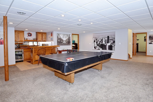 game room with light carpet, a dry bar, beverage cooler, visible vents, and a drop ceiling