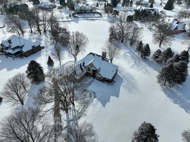 snowy aerial view featuring a residential view