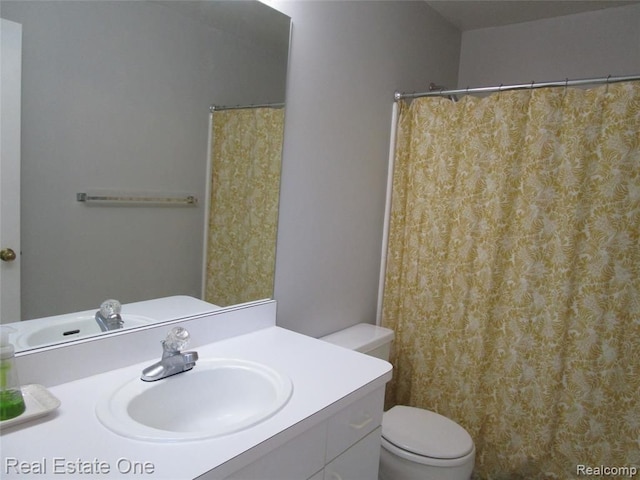 bathroom with vanity and toilet