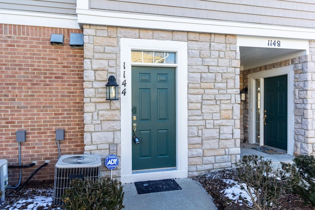 property entrance featuring central AC