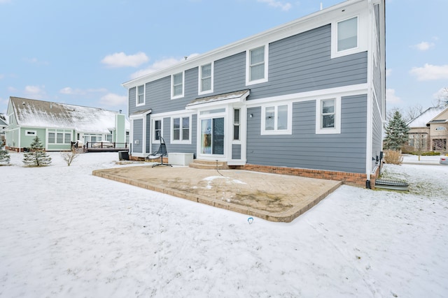 view of snow covered house