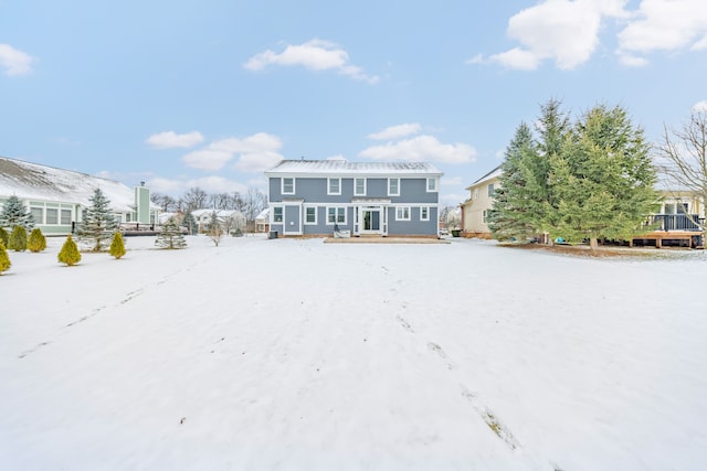 view of snow covered property