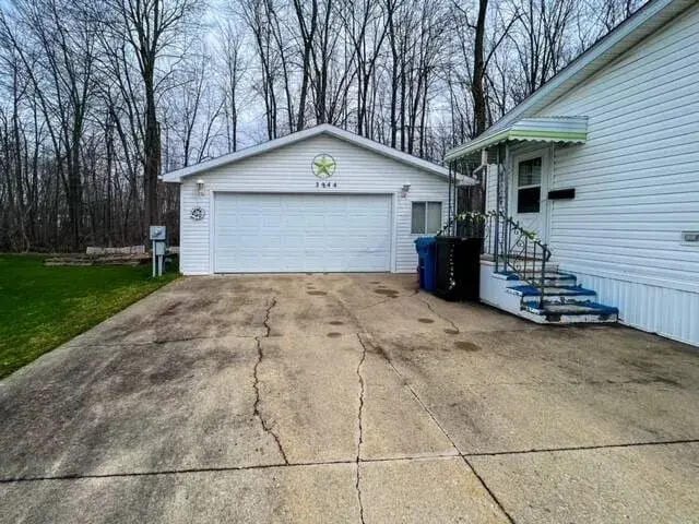 garage with a lawn