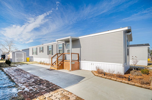 view of front of house with a storage shed