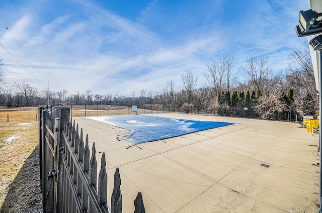 view of swimming pool with a patio