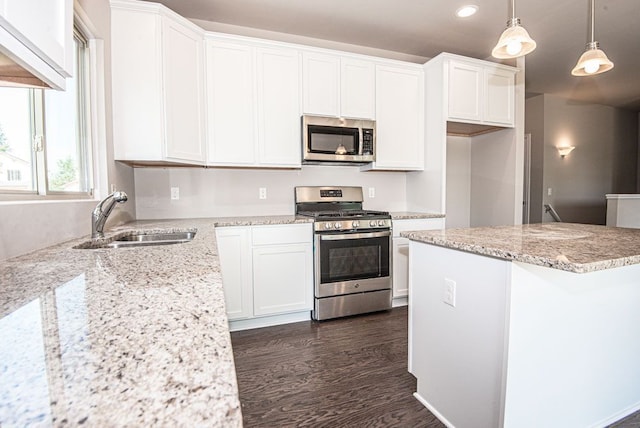 kitchen featuring white cabinets, recessed lighting, appliances with stainless steel finishes, and a sink