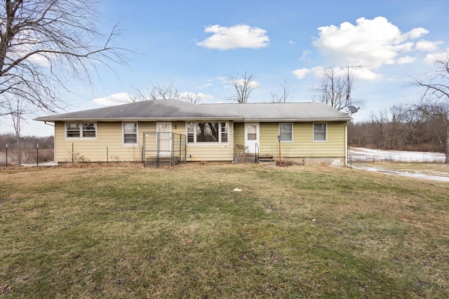 single story home with a front yard