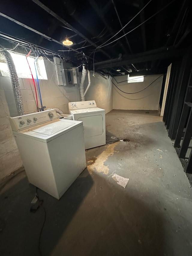 basement with electric panel and independent washer and dryer