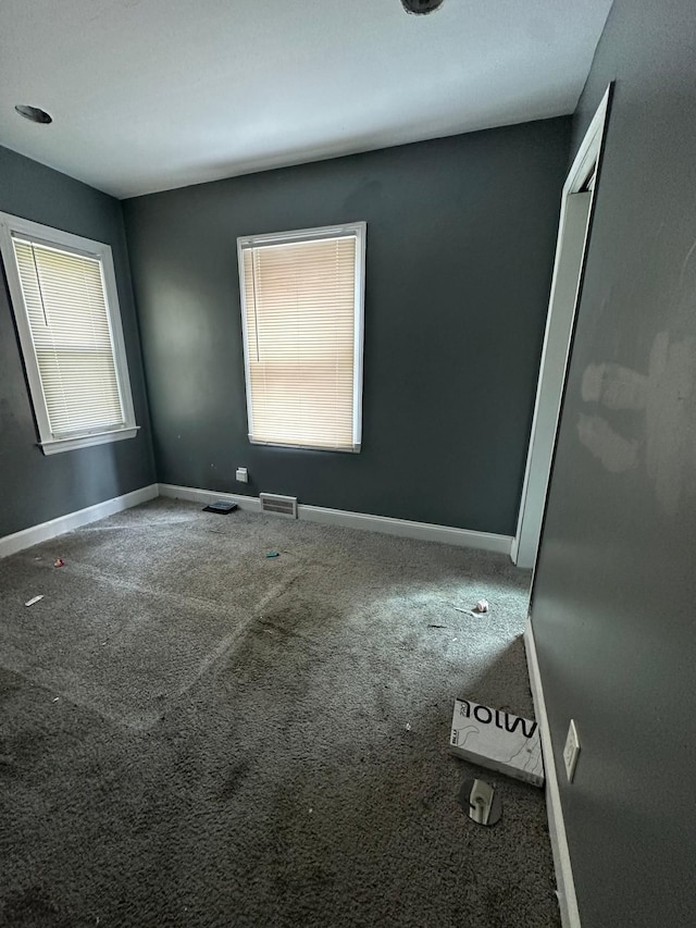 empty room with carpet flooring