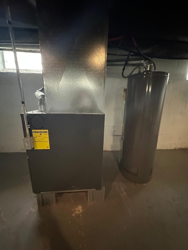 utility room featuring gas water heater