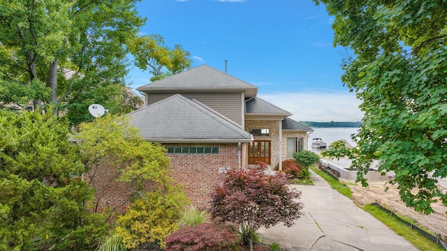 view of front of home featuring a water view