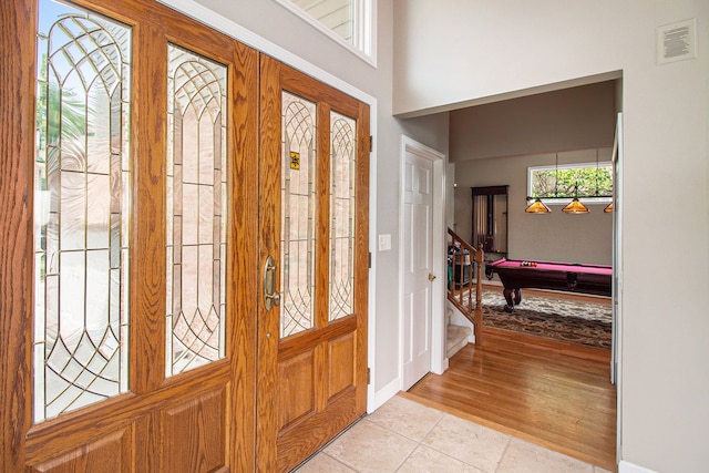 tiled foyer entrance featuring billiards