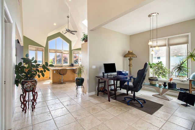 office space featuring ceiling fan and high vaulted ceiling