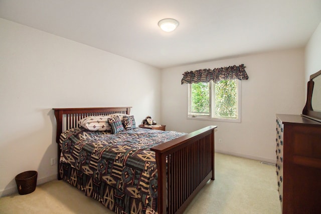 bedroom with light carpet